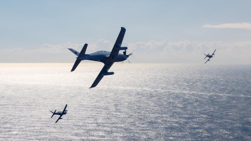Pilatus PC-21A aircraft from No 4 Squadron based at RAAF Base Williamtown fly in formation on transit to Sydney in support of an Air Force 2021 commemorative service held at the Anzac Memorial in Hyde Park.