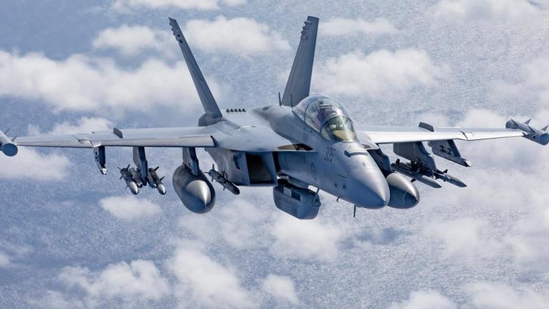 An EA-18G Growler from No. 6 Squadron conducts air-to-air formation flying