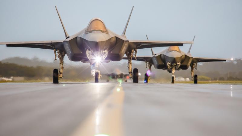 F-35A Lightning II aircraft A35-036 and A35-037 taxi back to the lines at RAAF Base Williamtown