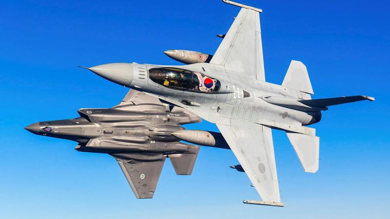Republic of Korea Air Force KF-16U Fighting Falcon and Royal Australian Air Force F-35A Lightning II aircraft conduct a flight together as part of Exercise Pitch Black 2022.