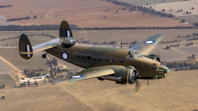 A Royal Australian Air Force Lockheed Hudson aircraft from No. 100 Squadron flies over Temora, NSW, during an air-to-air photography exercise.