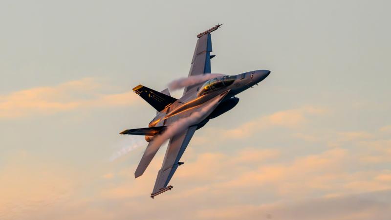 A Royal Australian Air Force F/A-18F Super Hornet aircraft performs a handling display over Mindil Beach during Exercise Pitch Black 26.