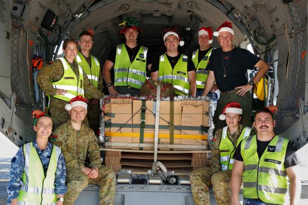 No 35 Squadron and Australian Army’s 176 Air Dispatch Squadron personnel with the Christmas Drop load secured on a C-27J Spartan prior to its delivery to Lockhart River in December 2019. Image: CPL Colin Dadd